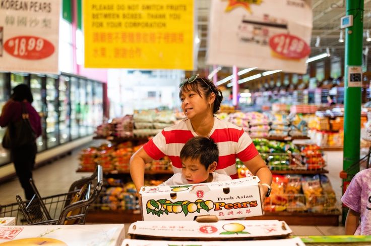 A mother and her yound child in the supermarket 